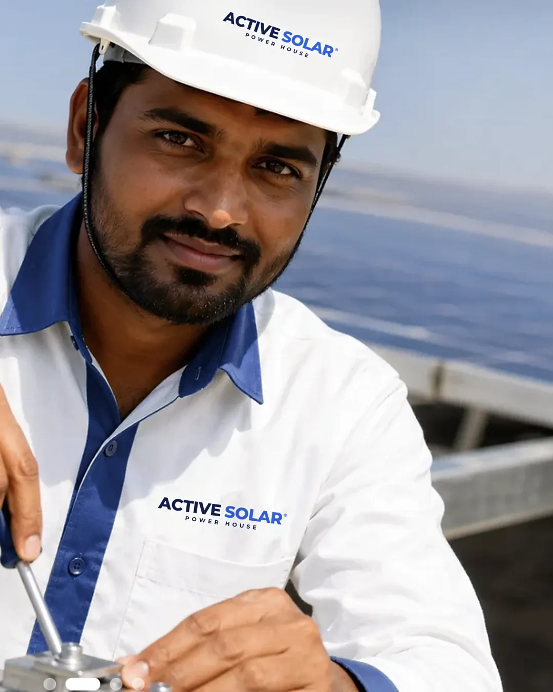 An Active Solar House engineer on a rooftop array in Bharuch